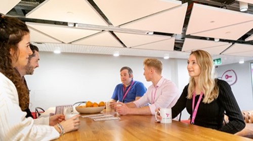RB employees from siting around table having discussion