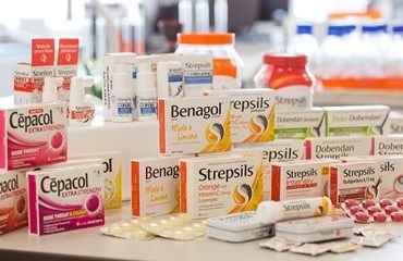 Collection of different types of Strepsil boxes, packets and tubs