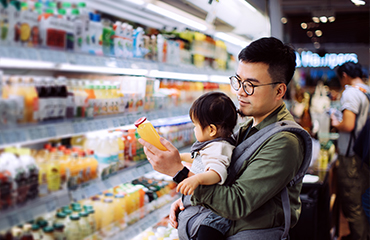 Man with son in supermarket