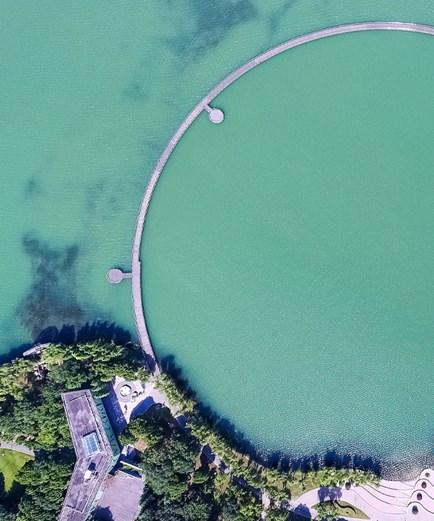 Aerial View of a Circular Lake Pedestrians in Taihu Lake.