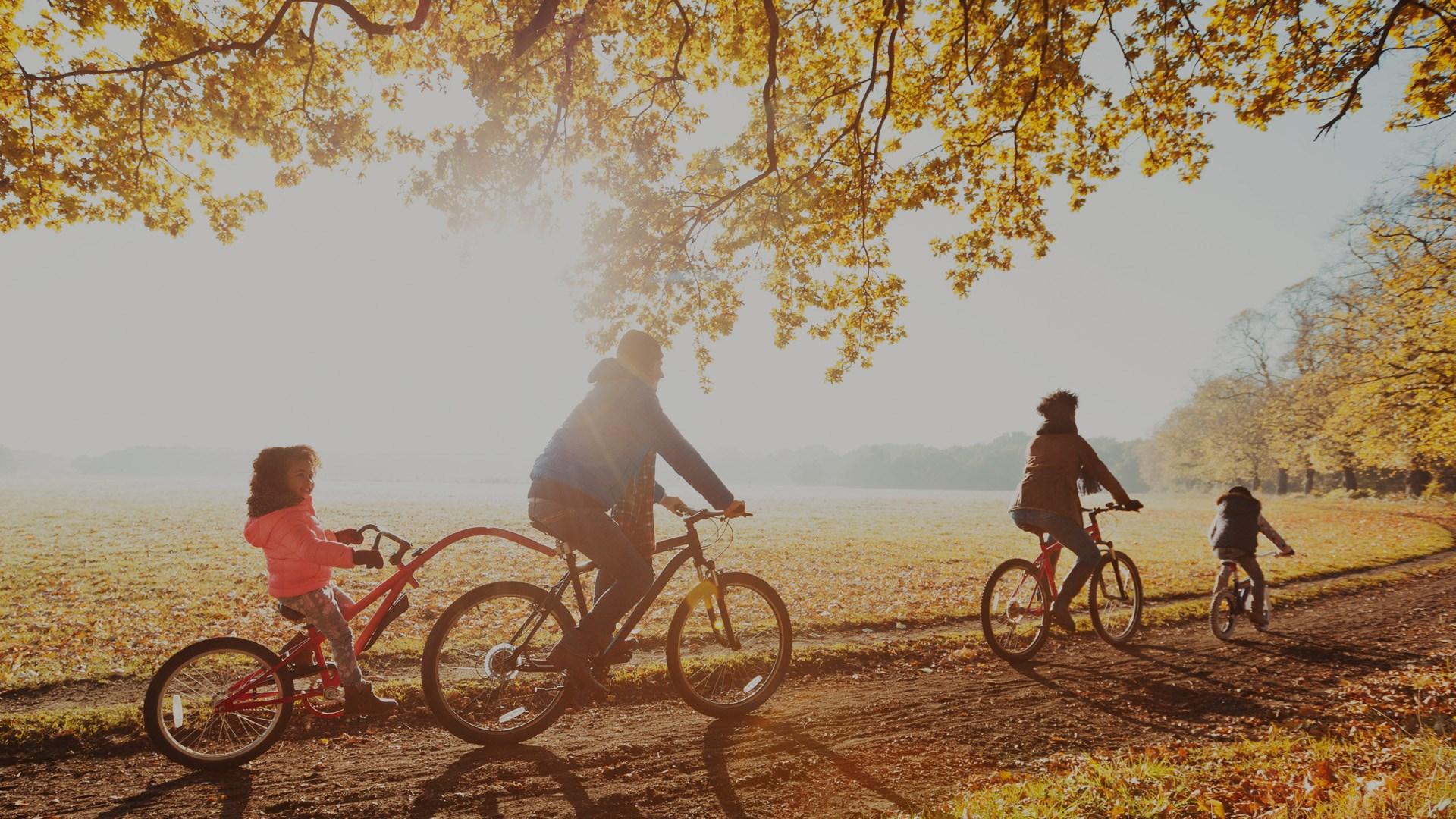 Young Family on a bike ride on an Autumnal day.