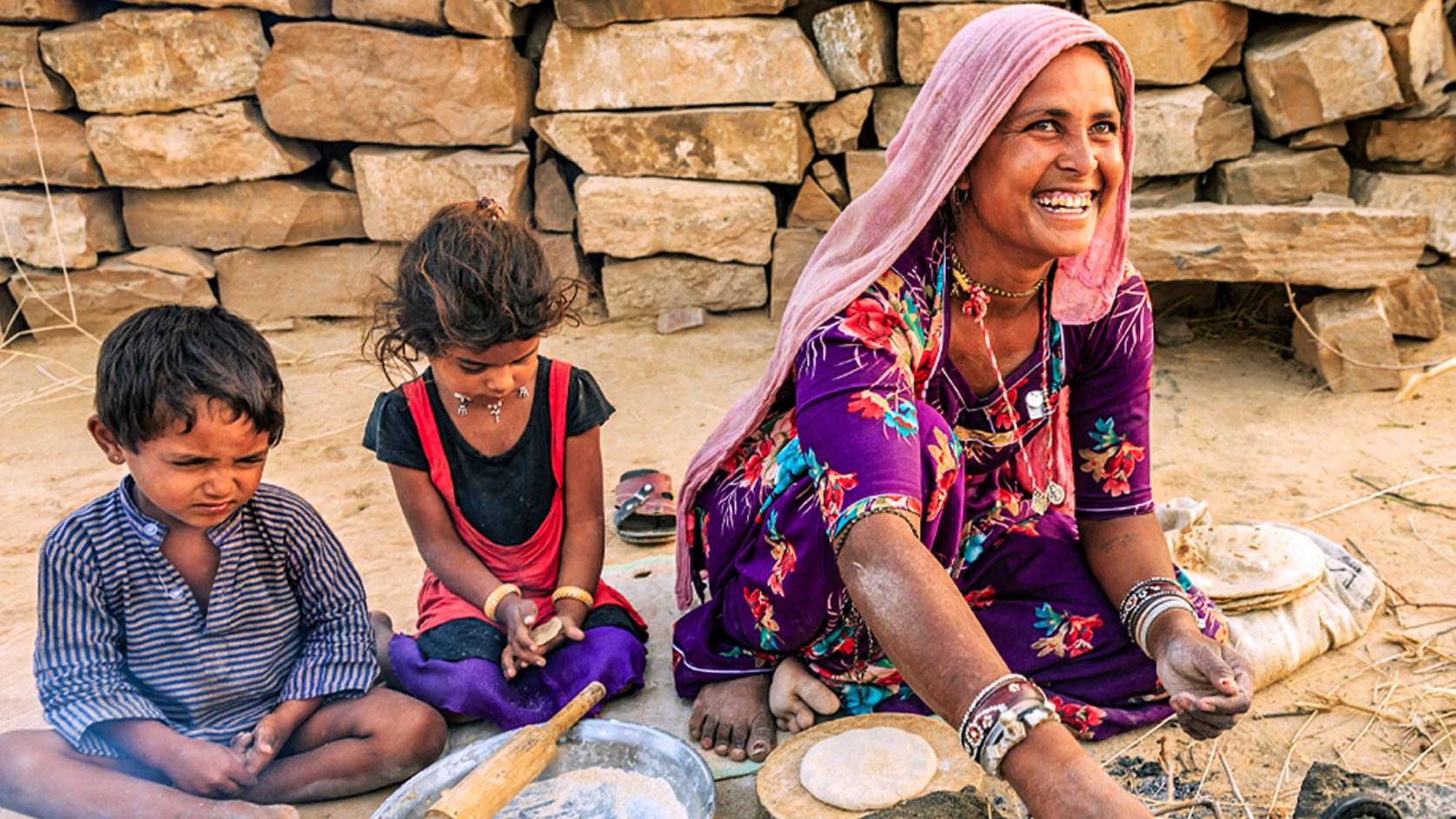 Asian woman and children making bread