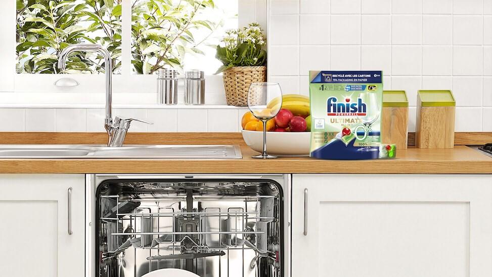 New Finish Powerball packaging on a kitchen counter above an open dishwasher